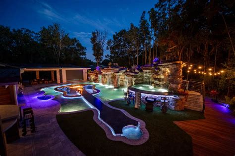 This Guitar Shaped Pool Features a Rock Waterfall and Swim-up Bar - Mad ...