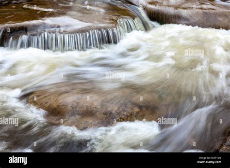 Closeup Of Rushing Water Over Rocks In A Creek Stock Photo Alamy