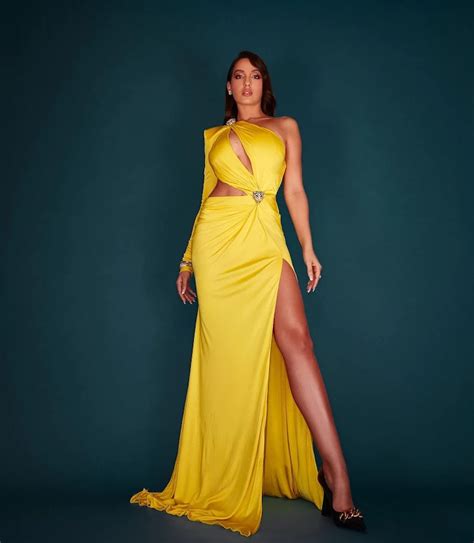 Nora Fatehi In Yellow Dress Flaunts Her Fine Curves And Sexy Legs See New Hot Photos
