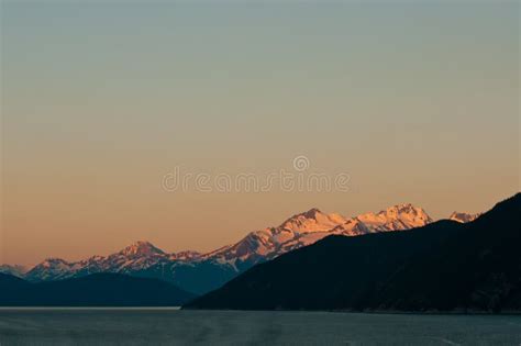 Snowy mountains at sunrise stock photo. Image of majestic - 21397122