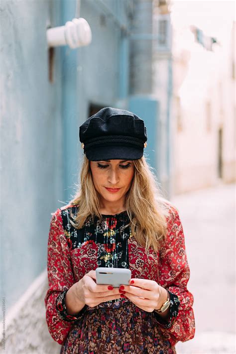 Blonde Woman Using Mobile Phone By Stocksy Contributor Pardina Studio X Katya D Stocksy
