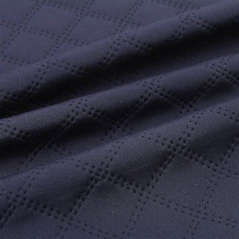 China Embossed 4 Way Stretch Softshell Bonded Polyester Spandex Fleece