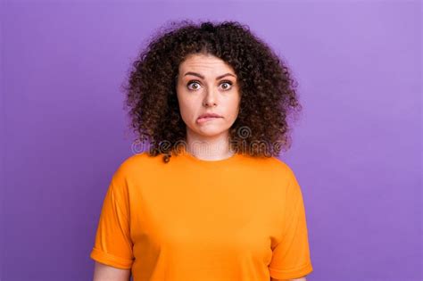 Photo Of Nervous Uncertain Woman Wear Orange T Shirt Biting Lip Feeling