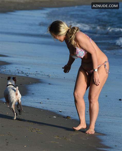 Frankie Essex Jogs On The Beaches Of Tenerife With Her Multicolored Skimpy Bikini On Her