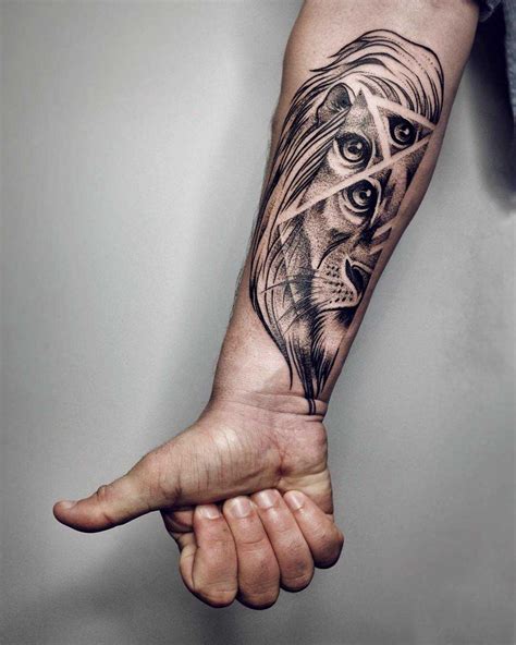 Lion tattoo on the forearm by Sasha Tattooing - Tattoogrid.net