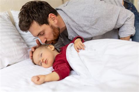 Handsome Brunette Father Kissing Sleeping Infant Baby Tenderly Stock Image Image Of Daughter