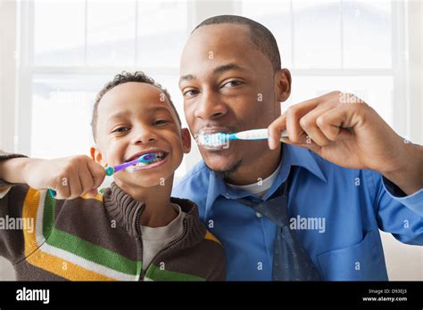 Black Kids Brushing Teeth