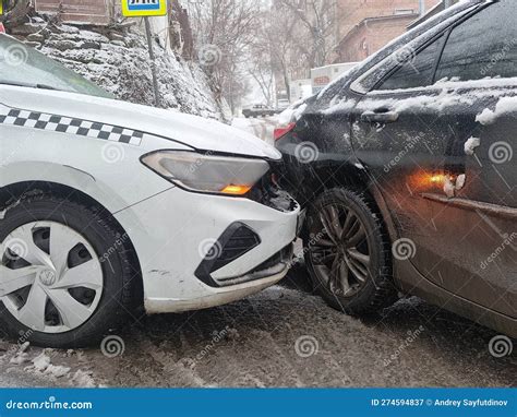 He Collision Of A White Taxi And A Black Car Due To Ice Editorial