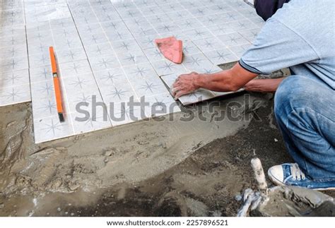 Worker Placing Ceramic Floor Tiles On Stock Photo 2257896521 Shutterstock