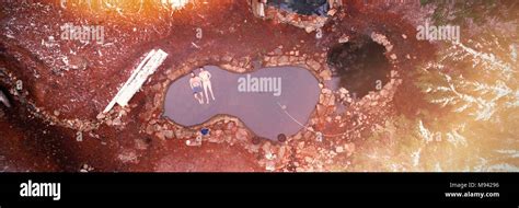 Two Men Lying In Hot Spring Pool During Winter Stock Photo Alamy