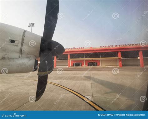 Runway Airstrip In The Airport Terminal With Marking On Blue Sky With