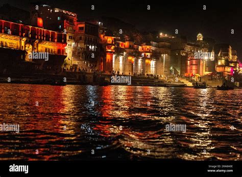 Night view of the palaces on the banks of the Ganges River in Varanasi (Benares), India Stock ...