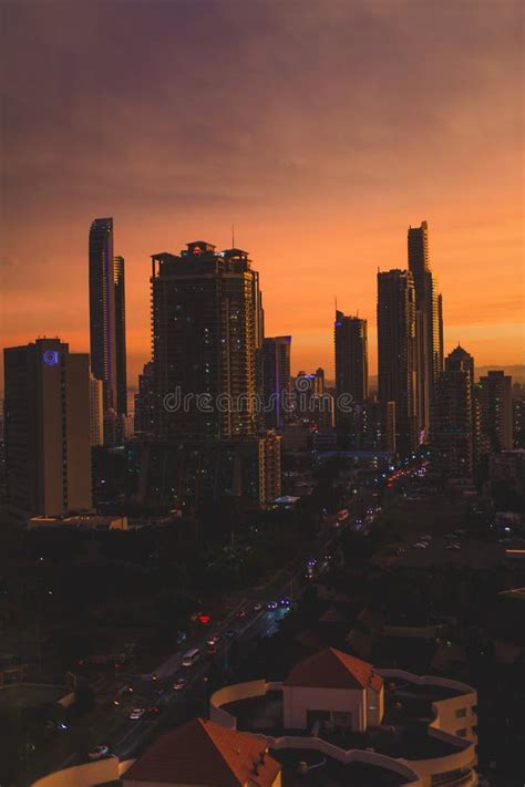 Dramatic Orange Sunset Over The Coastline And Buildings Of Surfers