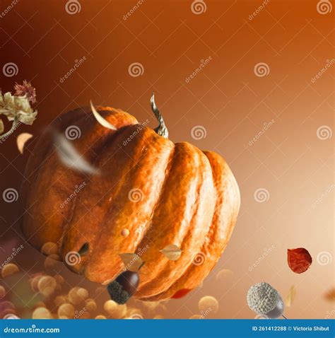 Flying Pumpkin With Falling Leaves On Brown Background Stock Photo