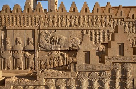 an intricately carved wall in the shape of a castle with statues on each side