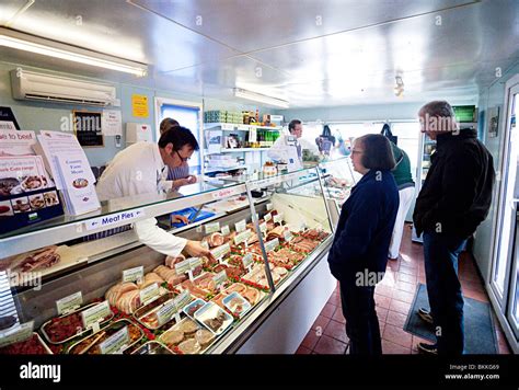 meat display at a butchers shop Stock Photo - Alamy