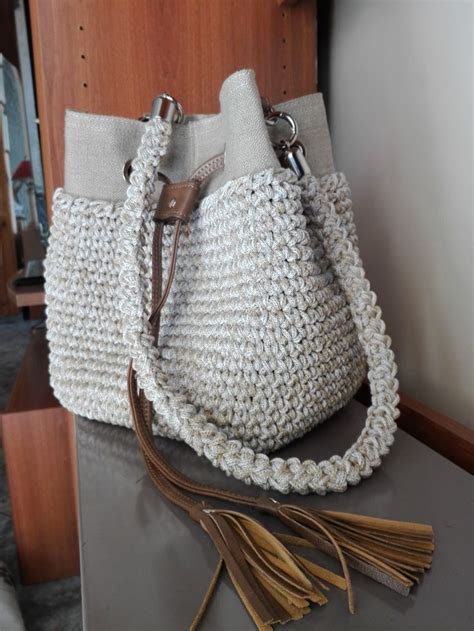 A White Purse Sitting On Top Of A Table