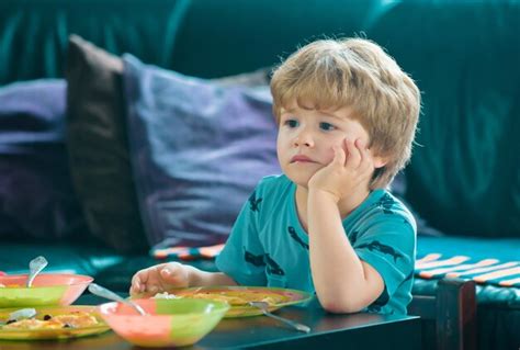 Premium Photo | Baby child eating food kid boy eating healthy food