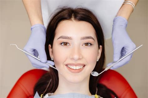 Premium Photo Portrait Of Smiling Caucasian Lady And Cropped Dentist