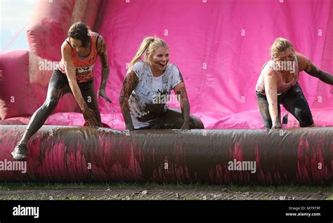 Women Take Part In The Pretty Muddy Charity Run For Cancer Research Uk In Hammersmith On