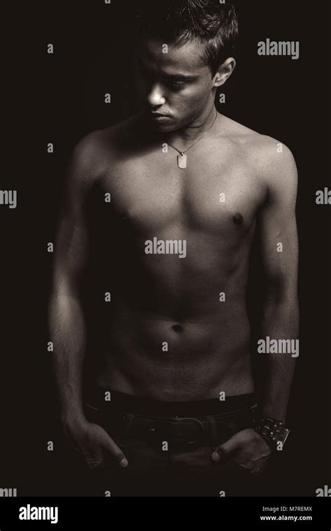 Sexy Shirtless Young Male Model Posing Fashion Over Dark Background