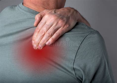 Man Suffering From Shoulder Blade Pain Trigger Point Hand Holding