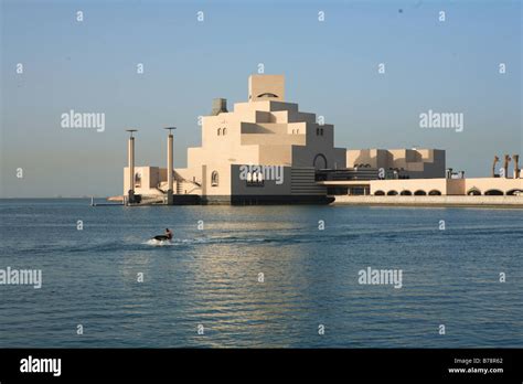 Man On A Jet Ski With The Islamic Art Museum In Doha Qatar In