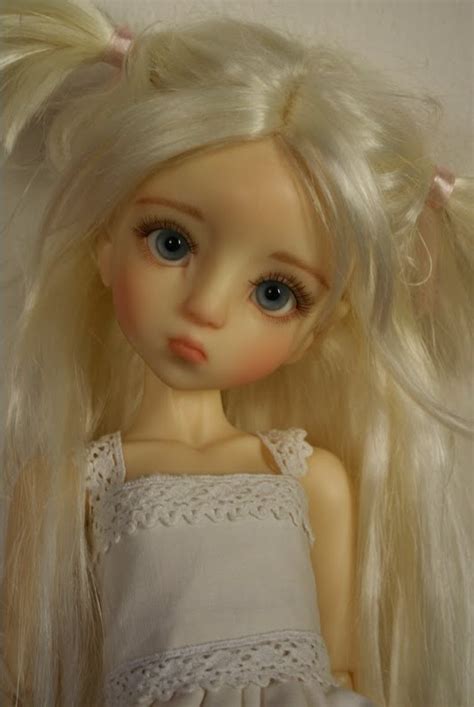 Blonde Haired Doll In White Dress