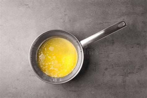 Saucepan with Melting Butter on Grey Table Stock Photo - Image of natural, lunch: 147864778