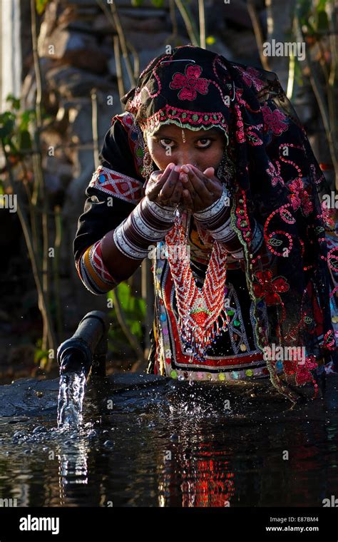 A Woman Of Kalbelia Tribe Drinking Waterpushkarrajasthanindia Stock