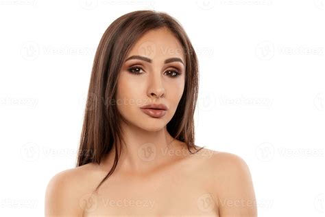 Close Up Portrait Of A Brunette Nude Model Girl With Professional Evening Make Up And Plump Lips