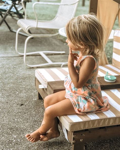 Photo Of Kid Sitting On A Chair · Free Stock Photo