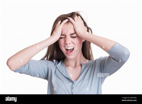 Young Woman With A Headache Holding Head And Screaming Stock Photo Alamy