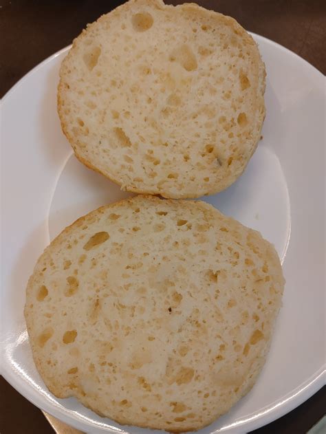 Two Pieces Of Bread Sitting On Top Of A White Plate Next To Another