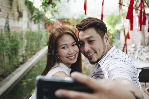 Happy Asian Couple Taking Selfie Together Stock Image Image Of Happy