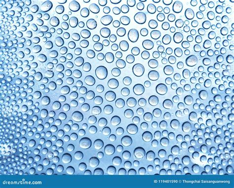 Water Drops On The Glass In A Cool Blue Tones In The Rainy Season For