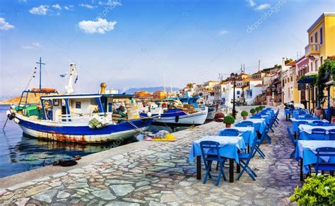 Traditional Greece series - Chalki island with old boats and taverna ⬇ ...