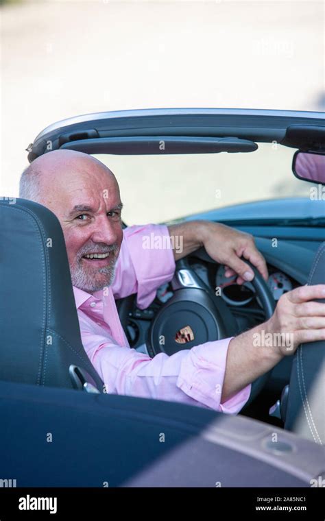 Senior man in his sports car Stock Photo - Alamy