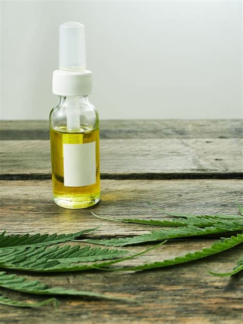 Cannabis with Extract Oil in a Bottle Stock Photo - Image of bottle ...