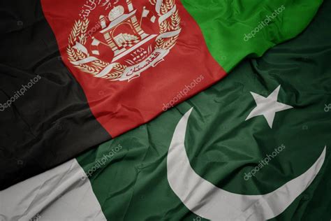 Waving Colorful Flag Of Pakistan And National Flag Of Afghanistan