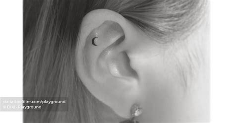 Micro Crescent Moon Tattoo Located On The Ear