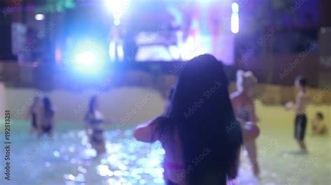 girls in a bikini dance in the pool at an aqua party 素材庫影片 Adobe Stock