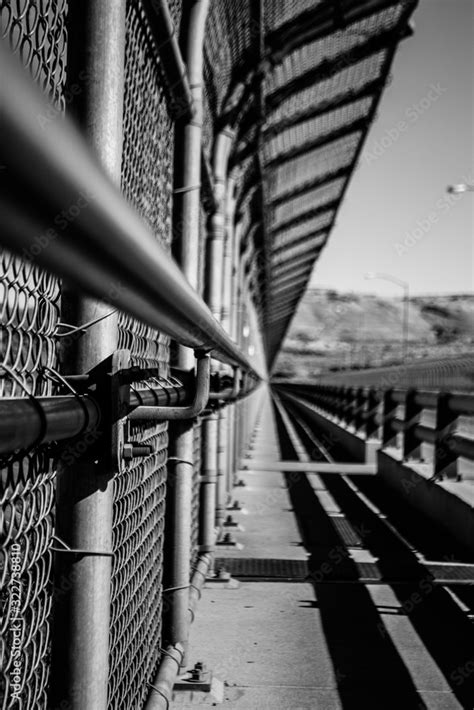 Metal border fence preventing crossings and increasing safety, showing ...