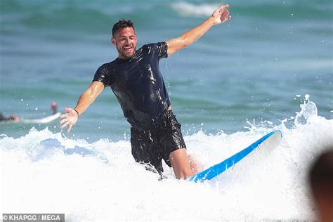Caroline Flack S Ex Andrew Brady Mingles With A Bikini Clad Woman In Australia Daily Mail Online