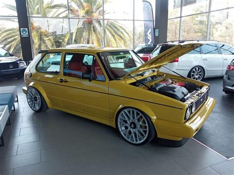 Yellow Volkswagen Golf with Hood Open