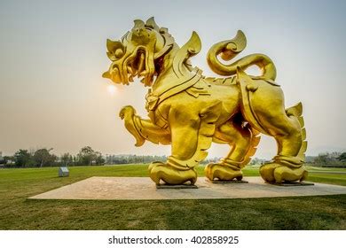 Gold Singha Statue On Sunset Background Stock Photo 402858925