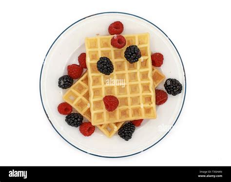 Fresh Belgian Waffles With Raspberrys And Blackberries On A Plate