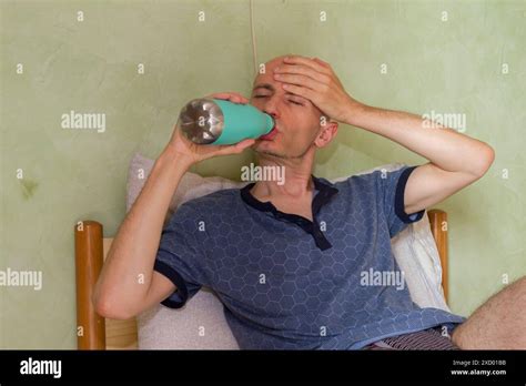White Man Drinking Water During A Hot Summer Day At Home Stock Photo Alamy