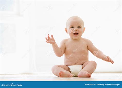 Baby Sitting Indoors Smiling Royalty Free Stock Photography Image