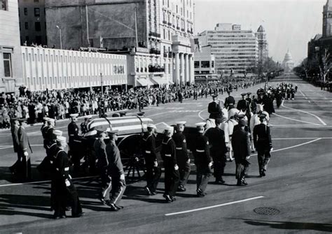 A military honor guard escorts the cortege bearing President John F ...